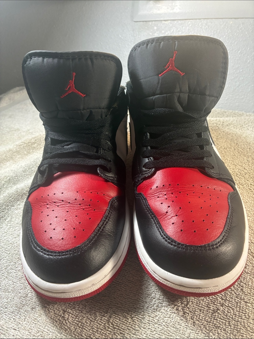 Jordan men’s' Retro High-Top Sneakers in Black and Red